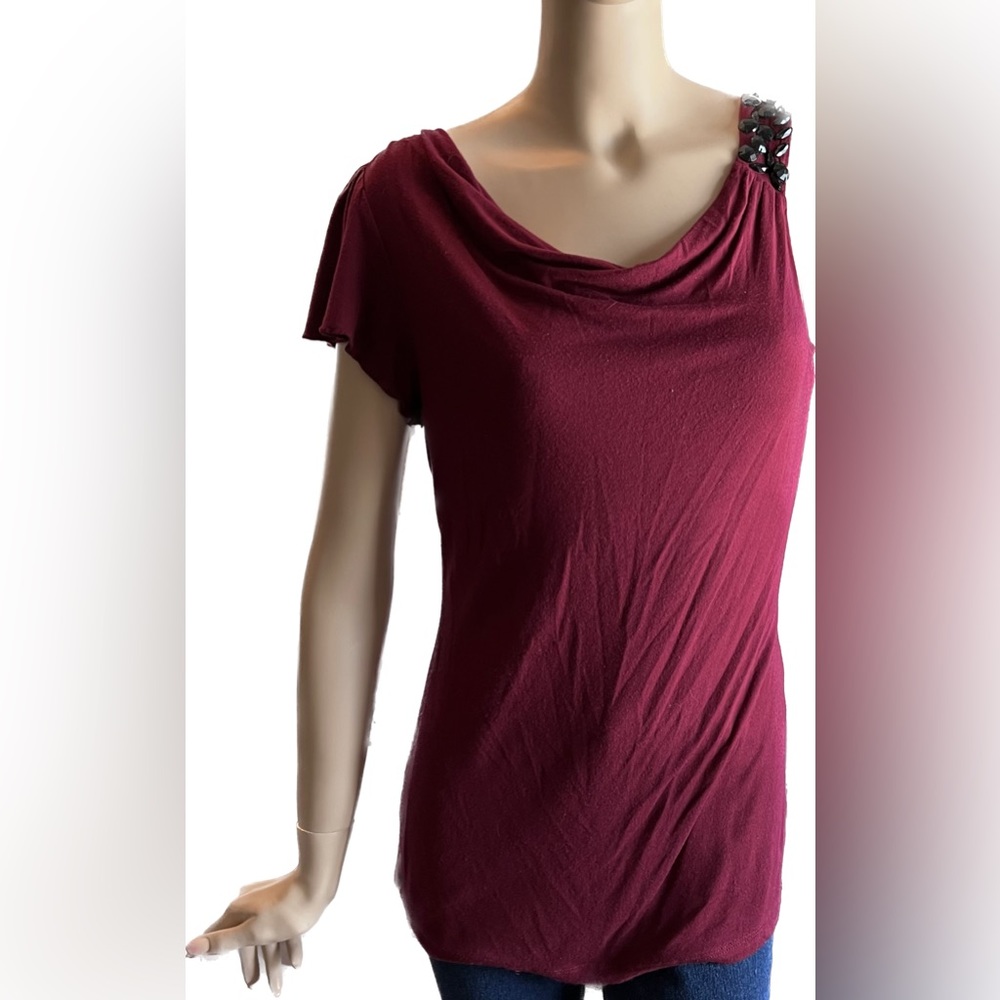 Asymmetrical dark red top with gemstone detailing